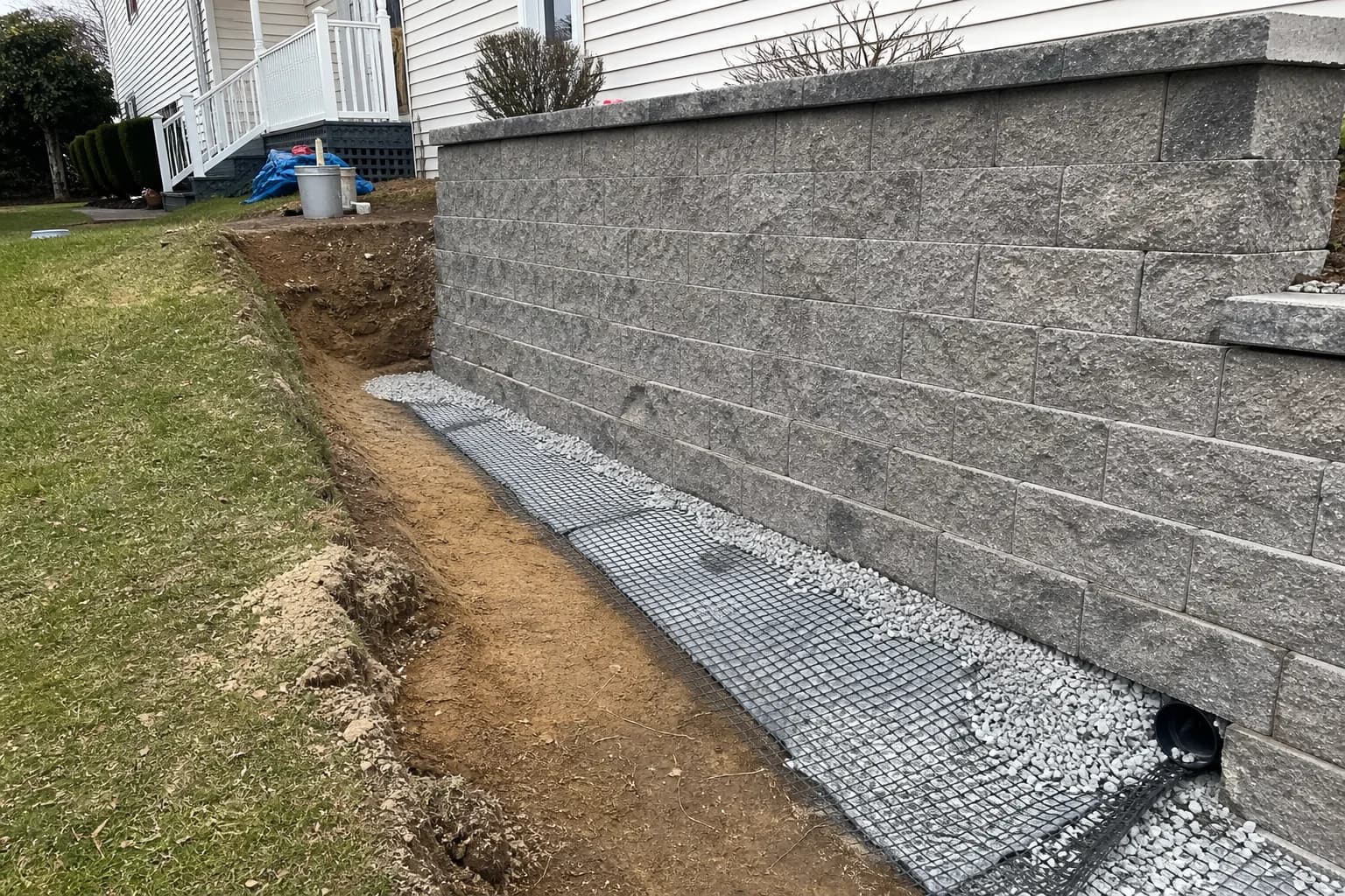 The Drainage Details Behind a Long-Lasting Retaining Wall